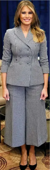  ??  ?? Melania Trump: The First Lady looks powerful in this Dior ensemble with wide trousers and shoulder pads