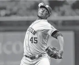  ?? Brian Blanco / Getty Images ?? Astros reliever Michael Feliz needed just eight pitches to work a scoreless sixth inning Friday night against the Rays and earn his first victory of the season.