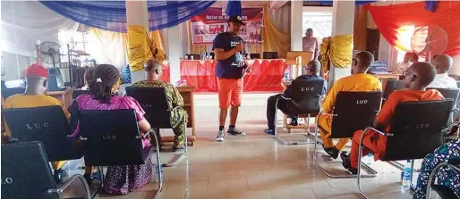  ??  ?? Mrs Vivian Onwuatuelo, a trainer speaking to youths during the programme