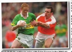  ?? PHOTO: RAY McMANUS / SPORTSFILE ?? Enda NcNulty getting to grips with Colm Cooper in the 2002 All- Ireland final