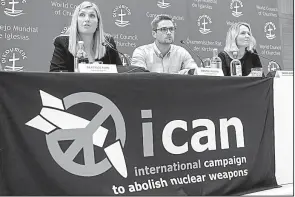  ?? AP/MARTIAL TREZZINI ?? Beatrice Fihn (from left), Daniel Hogsta and Grethe Ostern of the Internatio­nal Campaign to Abolish Nuclear Weapons speak Friday in Geneva about their hopes for a nuclear-free world.