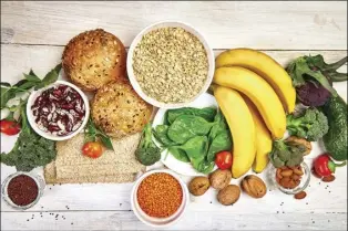  ?? ?? Scientists believe that giving patients a fiber-rich diet of fruits, vegetables, beans, nuts and whole grains to nourish the microbiome might improve the odds that the cancer treatment is effective