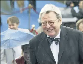  ?? MISHA JAPARIDZE — THE ASSOCIATED PRESS FILE ?? Film director Alan Parker arrives at the opening ceremony of 26th Moscow Internatio­nal Film Festival in Moscow on June 18, 2004. Parker, whose movies included “Bugsy Malone,” “Midnight Express” and “Evita,” has died at the age of 76. A statement from the director’s family says Parker died Friday in London after a long illness.