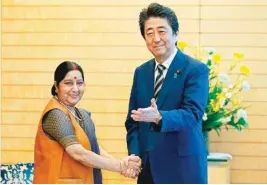  ?? AP/PTI ?? Indian Foreign Minister Sushma Swaraj meets with Japan's Prime Minister Shinzo Abe at Abe's official residence in Tokyo on Friday