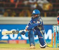  ?? AFP ?? Mumbai Indians Parthiv Patel sweeps a shot during their Indian Premier League match against Gujarat Lions at the Saurashtra Cricket Associatio­n Stadium in Rajkot yesterday.