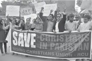  ?? AP Photo/ Pervez Masih ?? ■ Pakistani students protest in favor of the Christian community Feb. 28 in Hyderabad, Pakistan. Pakistan’s blasphemy law terrifies minorities, quashes dissent and emboldens radicals, who use it to whip up extremism in the population and threaten those...