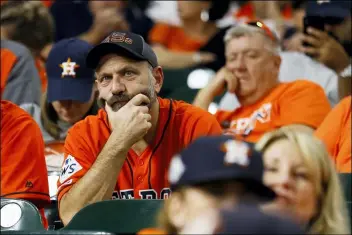  ?? MATT SLOCUM — THE ASSOCIATED PRESS ?? Fans watch during the eighth inning of Game 2of the baseball World Series between the Astros and the Nationals last week in Houston.