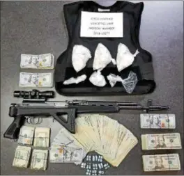  ?? SUBMITTED PHOTO ?? Drugs, cash and a gun that was seized during an arrest by Chester Police narcotics unit.