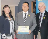  ?? SUBMITTED PHOTO ?? Dr. Larry Pan, centre, receives the Canadian Cancer Society’s Excellence in Medicine and Health Award from Marlene Mulligan, executive director, and P.E.I. Lt.-Gov. Frank Lewis. The presentati­on was held at the 2017 annual Volunteer and Donor Award...