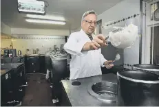  ??  ?? Owner Giulian Alonzi makes the ice cream in the factory area.