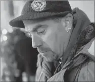  ?? Rebecca Droke/Post-Gazette ?? Charles Riley, 43, formerly of Freeport, waits in line Wednesday to sleep at the cold-weather shelter Downtown at Smithfield Unity Church.