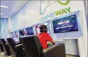  ?? GAMEWAY ?? A gaming lounge at Dallas-Fort Worth includes leather chairs, 43-inch TVs and noise-canceling headphones.