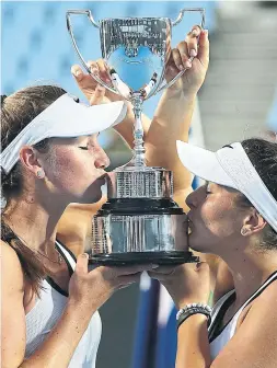  ?? PAT SCALA GETTY IMAGES FILE PHOTO ?? The careers of Carson Branstine and Bianca Andreescu have taken different paths since they shared the Australian Open junior doubles trophy in 2017.