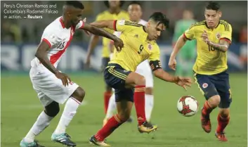 ?? — Reuters ?? Peru’s Christian Ramos and Colombia’s Rodamel Falcao in action.