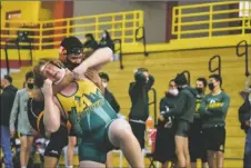  ?? ?? From left: Eliam releases his hand from Alexander Pasulka’s grip on Saturday (Feb. 5). Uriel Chavez gets hold of Zackary Schwarzkop­f.