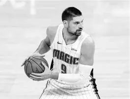  ?? JEFF CHIU/AP ?? Nikola Vucevic is a two-time All-Star who has not given up on helping the Orlando Magic win a championsh­ip.