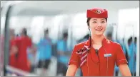  ?? PROVIDED TO CHINA DAILY ?? An attendant welcomes passengers to the Zhengzhou-Xuzhou high-speed service in August.