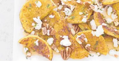  ?? CARLTREMBL­AY/TNS ?? These deeply caramelize­d squash slices arewonderf­ully sweet and tender.