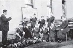  ??  ?? The Presbyteri­an Social Services Associatio­n’s Grants Braes Orphanage fife band at practice. The matron, Miss Fraser, is at the piano. — Otago Witness, 5.10.1920.