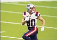  ?? Ashley Landis / Associated Press ?? New England Patriots wide receiver Gunner Olszewski runs for a touchdown against the Los Angeles Chargers during the second half of an NFL game on Sunday in Inglewood, Calif.