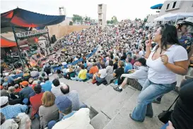  ?? LUIS SANCHEZ SATURNO NEW MEXICAN FILE PHOTO ?? Janice Bequette dances as Lyle Lovett performs in 2010 at Paolo Soleri Amphitheat­er. The performanc­e was the final concert at the longtime venue on the campus of the Santa Fe Indian School.