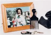  ??  ?? BobRoss artifacts andmemorab­ilia, including a hair pick, are on display in Muncie, Indiana, where his showwas filmed.