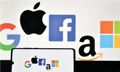  ?? Photograph: Justin Tallis/AFP/Getty Images ?? Collective­ly the five companies market value is worth more than a third of the entire S&P 500 index of America’s 500 largest traded companies.