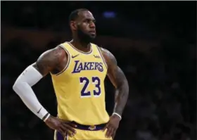  ?? KELVIN KUO - THE ASSOCIATED PRESS ?? FILE - In this Oct. 4, 2018, file photo, Los Angeles Lakers forward LeBron James looks on during the first half of an NBA preseason basketball game against the Sacramento Kings in Los Angeles. The only certainty in the NBA this season is that James won’t win the East, ending an eight-year run of that, four in Miami and four in Cleveland.