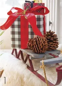  ??  ?? 1[1] A child’s sled is a fun, creative way to add dimension and height to your gift groupings.