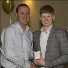  ??  ?? Rathkenny’s James O’Hare receives his Leinster MFC medal from county senior manager Andy McEntee at the underage presentati­on night in Navan O’Mahonys.