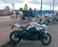  ??  ?? ABOVE LEFT: The romance of a seaside horse-drawn buggy ride, spoilt slightly by a bloke in a high-viz jacket. .. \ LEFT: Jeez, I knew I rode a ! long way that day, I didn 't \ think I'd gone THAT far ...
ABOVE & BELOW:
Oh, for a set of knobblies . ..