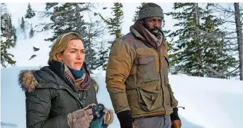  ?? FOTO: 20TH CENTURY FOX/DPA ?? Dreharbeit­en unter harten Bedingunge­n: Kate Winslet und Idris Elba in „Zwischen zwei Leben“.