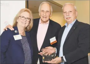  ?? Contribute­d photo ?? SilverSour­ce Executive Director Kathleen Bordelon and board Chairman Jerome Berkman present Reyno A. Giallongo Jr., First County Bank Chairman and CEO, and president of the First County Bank Foundation, an award for outstandin­g community leadership.