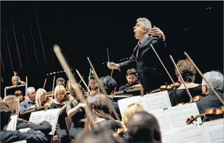  ?? Photograph­s by Marcus Yam Los Angeles Times ?? DAVID LOCKINGTON conducts the Pasadena Symphony during a high-octane season-closing performanc­e of Beethoven’s Ninth.