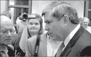  ?? Arkansas Democrat-Gazette/BILL BOWDEN ?? Sam Montgomery, a video tracker for America Rising LLC, keeps a lens trained on Mike Ross during his campaign appearance at the Fort Smith breakfast event Friday.