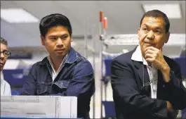  ?? BAY AREA NEWS GROUP FILE PHOTO ?? Lan Diep, left, and Manh Nguyen, right, listen to employees during a recount at the Santa Clara County Registrar of Voters in San Jose in July 2016.