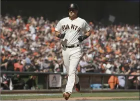  ?? AP PHOTO/ERIC RISBERG ?? San Francisco Giants’ Joe Panik runs for home plate after hitting a home run off Seattle Mariners starting pitcher Marco Gonzales in the fourth inning of a baseball game on Tuesday, in San Francisco.