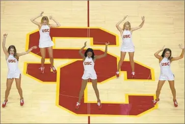  ?? Kirby Lee Associated Press ?? USC Song Girls perform at the men’s basketball game Nov. 28 in what would be their final appearance.