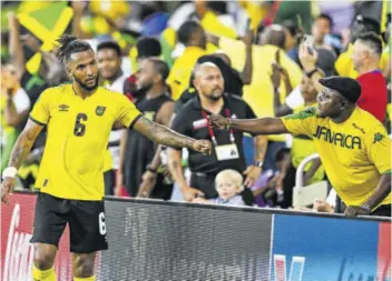  ?? (Photos: AFP) ?? Jamaica’s Liam Moore celebrates with spectators after the team won the Concacaf Gold Cup football match between Guadeloupe and Jamaica at the Exploria Stadium in Orlando, Florida, on Friday.