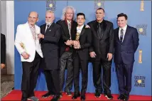  ?? KEVIN WINTER/GETTY IMAGES/TNS ?? Jim Beach (from left), Roger Taylor and Brian May of Queen, actor Rami Malek, producer Graham King and Mike Myers pose in the press room during the 76th annual Golden Globe Awards.