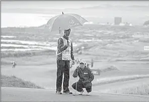  ?? AP/KENNY SMITH ?? South Korean I.K. Kim survived cold and rainy conditions Friday at Kingsbarns Golf Links to lead the Women’s British Open by two shots over American Lexi Thompson and England’s Georgia Hall.