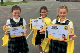 ?? STUFF ?? St Theresa’s School students Keilani McKay, 11, Brylee McKay, 8, and Lucy Dermody, 11, were presented with ASB St John in Schools Super Saver Bravery Awards for helping an 81-year-old woman who had hit her head and fallen in her garden.