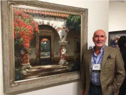 ??  ?? George Hallmark stands next to his painting Sagrado (Sacred), which won the museum purchase award.