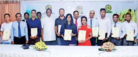  ??  ?? Recipients from Galle who attended the certificat­ion ceremony along with SLTDA Standard and Quality Assurance Director Chandana Wijeratne, Tourism Developmen­t and Christian Religious Affairs Minister John Amaratunga and SLTDA Chairman Kavan Ratnayaka...