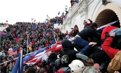  ?? Photograph: Shannon Stapleton/Reuters ?? Pro-Trump supporters storm the Capitol in January. Fairlamb’s 41-month term is the longest among 32 riot-related sentences handed down so far.