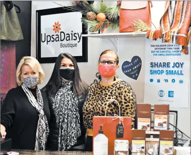  ?? BILL JONES/DAILY SOUTHTOWN PHOTOS ?? UpsaDaisy Boutique owners, from left, Julie Smith, Julie Lawton and Suzy Moore pose for a photo during Small Business Saturday. Lawton also oversees the Homewood Business Associatio­n, which expanded the village’s Small Business Saturday efforts to two days.