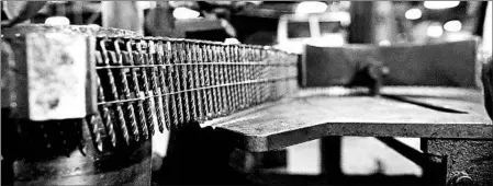  ?? BILL GREENBLATT/GETTY-AFP ?? Nails sit on a machine last month at an idled Mid Continent Nail Corp. plant in Poplar Bluff, Mo. Orders have slowed after steel tariffs started in June.