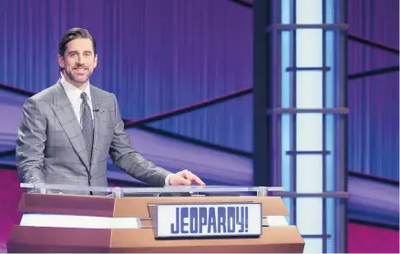  ?? JEOPARDY PRODUCTION­S INC. ?? Football star Aaron Rodgers stands at the lectern during his time as a guest host on “Jeopardy!”