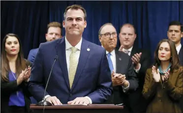  ?? SUE OGROCKI/ASSOCIATED PRESS ?? Oklahoma Gov. Kevin Stitt is applauded after speaking at a news conference, Nov. 1, 2019, in Oklahoma City, to announce that Oklahoma will release more than 400inmates after the board approved what they say is the largest single-day mass commutatio­n in U.S. history. Stitt, a Republican running for a second term, is facing criticism for a 2019mass commutatio­n he said saved the state millions of dollars in prison costs.