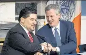  ?? Ed Reed Associated Press ?? NEW YORK Mayor Bill de Blasio, right, introduces Richard A. Carranza as the city’s schools chancellor.